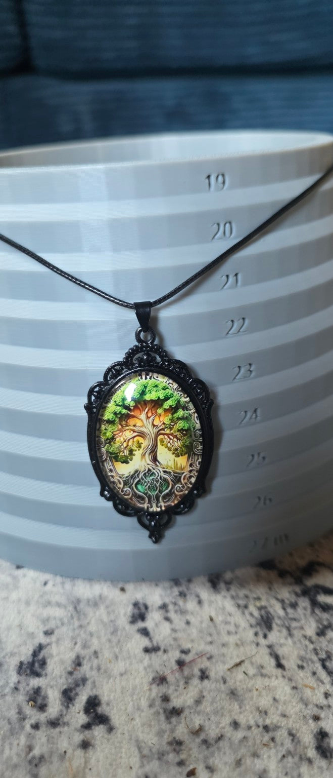 Green Tree of Life necklace shown on size display