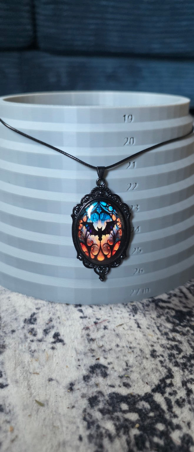 Bat pendant necklace shown on size display